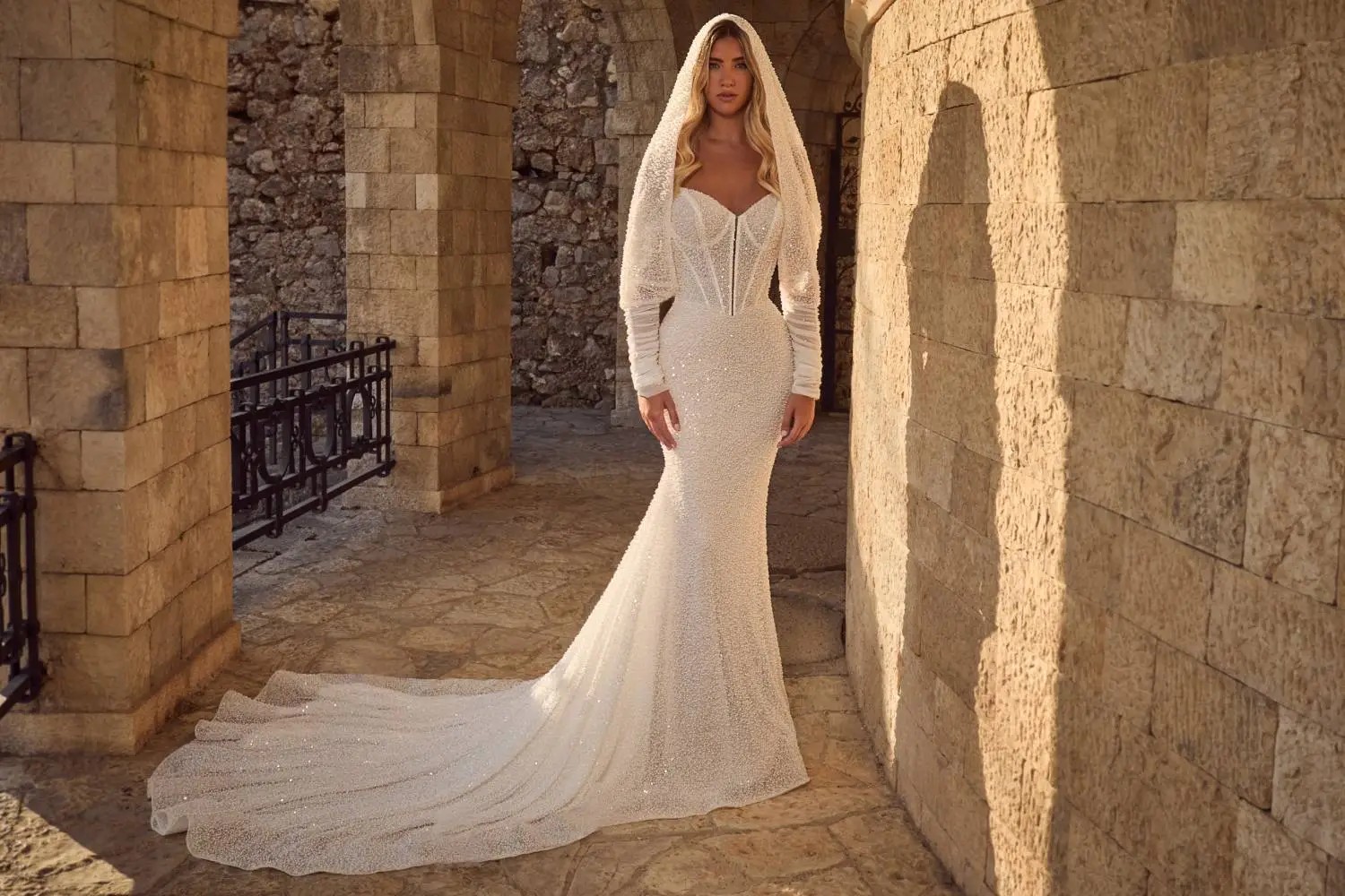 Model wearing a bridal gown. Mobile image