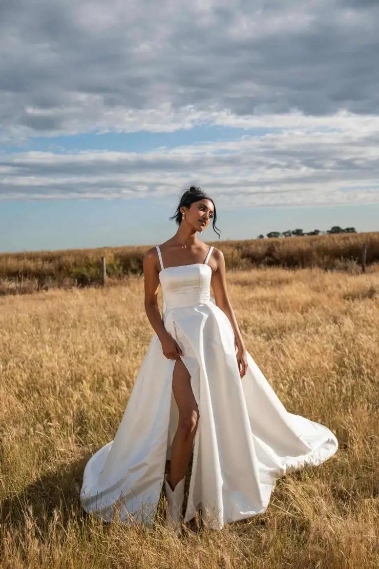 Model wearing white wedding gown