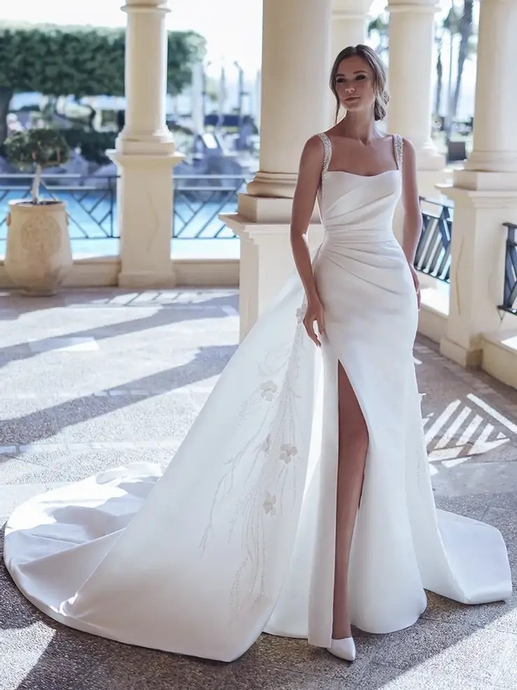 Model wearing a white gown